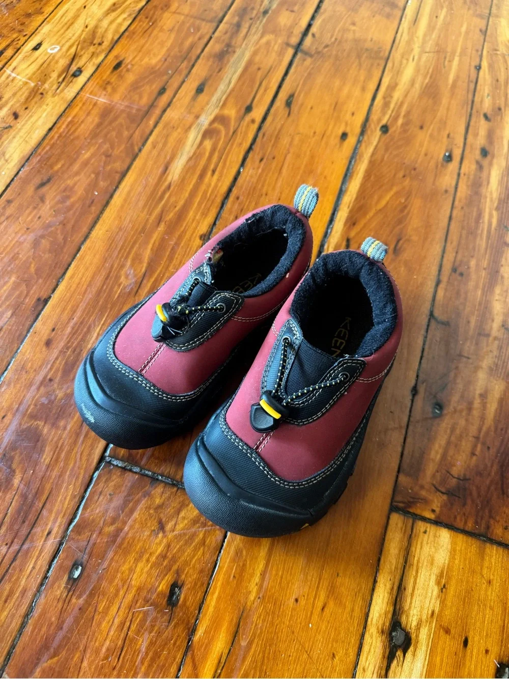 Keen Kids Slip-On Sneakers in Burgundy and Black with Yellow Accents